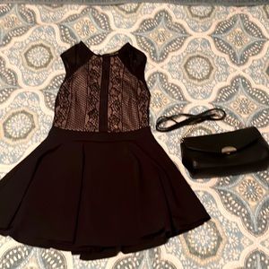 Black Lacey dress with built in shorts. Comes with black over the shoulder purse